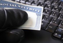 Identity Theft: Recommendations A black gloved hand holding a social security card
